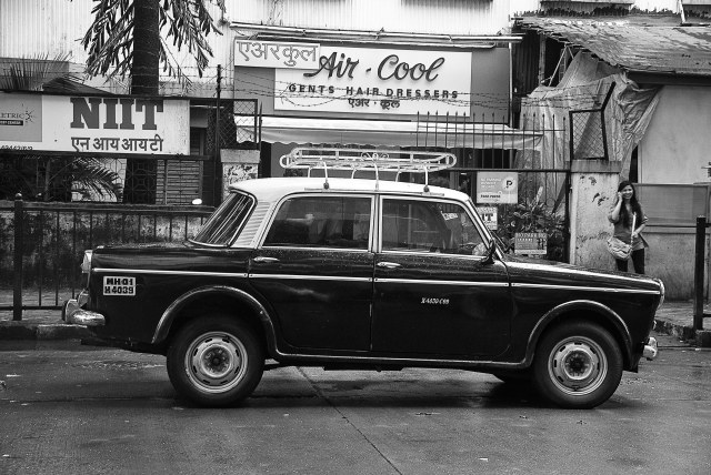 This is an endangered species of cabs in Mumbai. The 1970's Fiat taxies are under the scanner with the traffic department and are steadily being replaced by Cool cabs. Strange that this one is parked in front of a hair dressers parlor also dating back to the 70's!